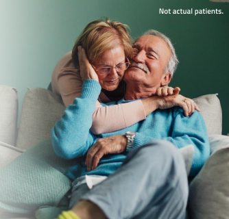 Senior man and woman hugging